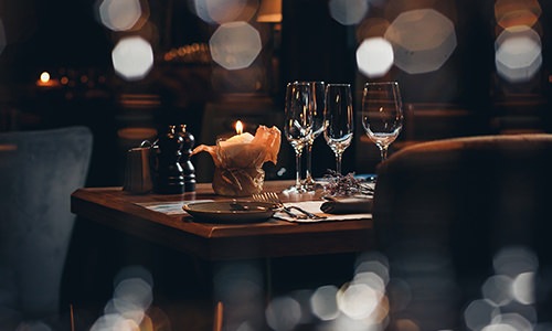 wine glasses and candle on a table