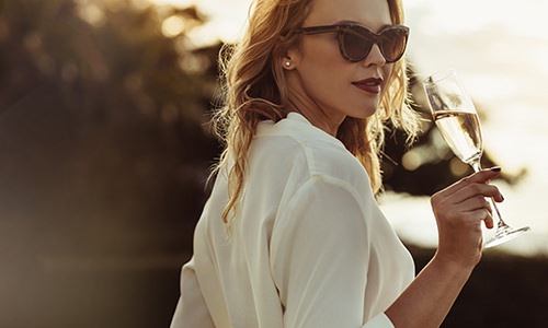 woman holding a champagne glass