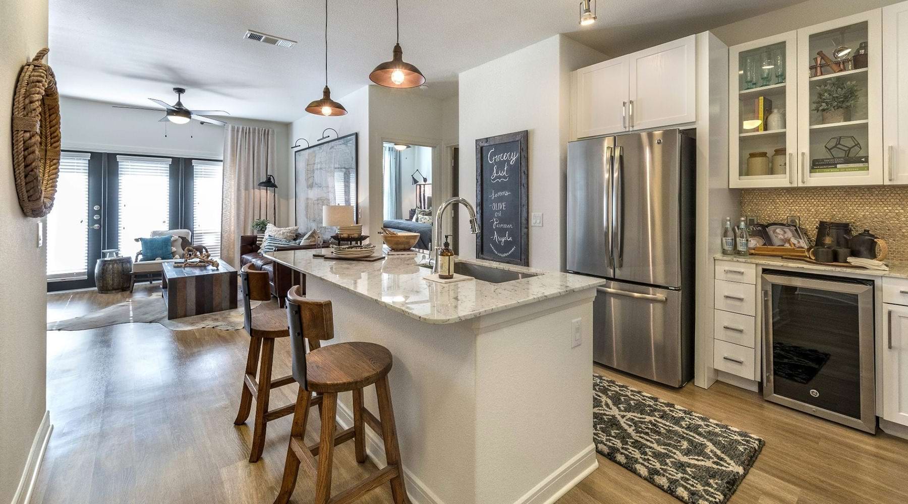 kitchen Spacious and well lit kitchen with wood floors and stainless steel appliances