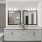 Large well lit bathroom with large mirror and white cabinets with a spacious walk in closet.