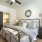 Spacious and well lit bedroom with plush carpet and large windows